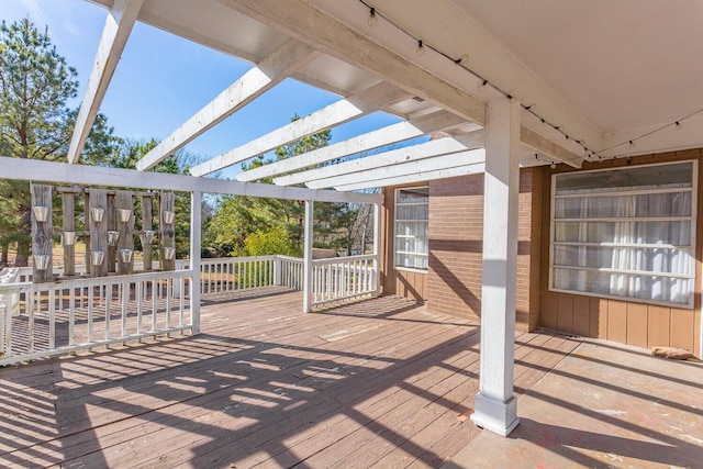 wooden deck featuring a pergola