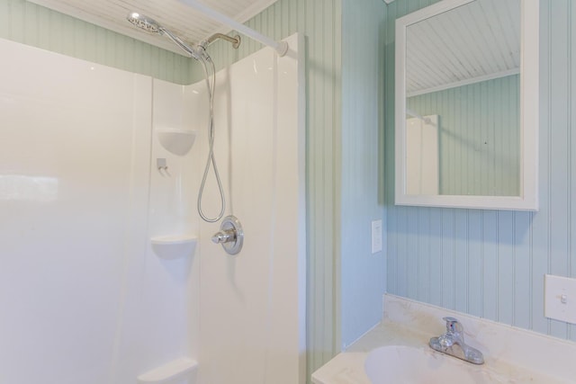 bathroom with walk in shower and vanity