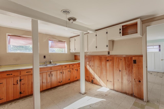 kitchen featuring sink and white cabinets