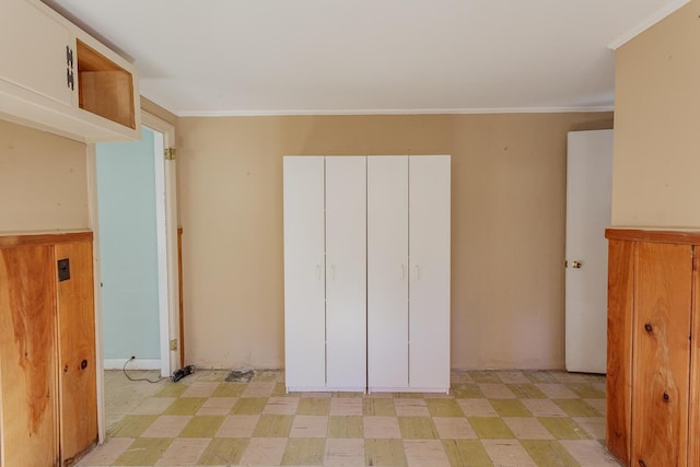 unfurnished bedroom featuring ornamental molding