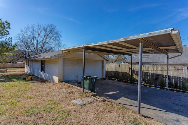 view of parking featuring a garage and a carport