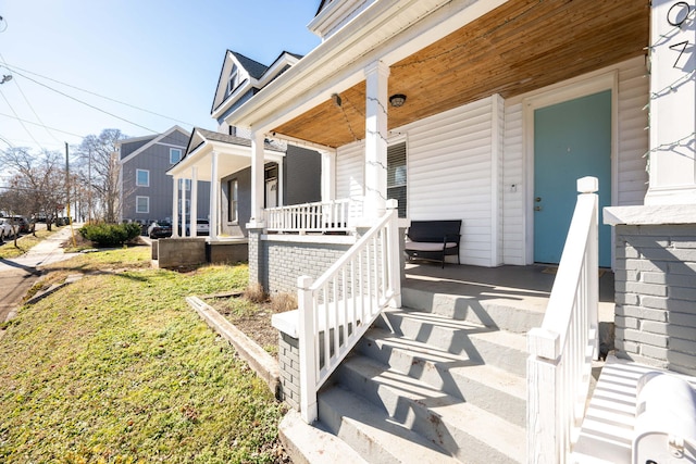 view of exterior entry featuring a porch