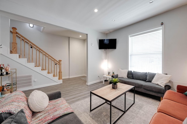 living room with light hardwood / wood-style flooring