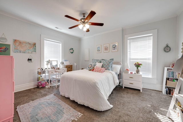 carpeted bedroom featuring ornamental molding and ceiling fan