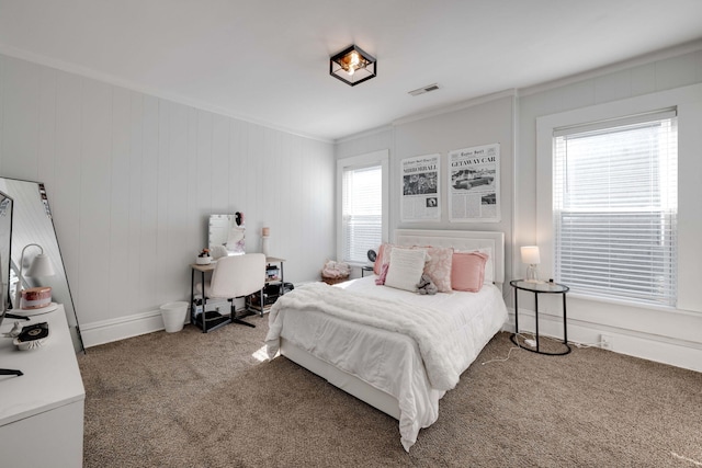 bedroom featuring ornamental molding and carpet flooring