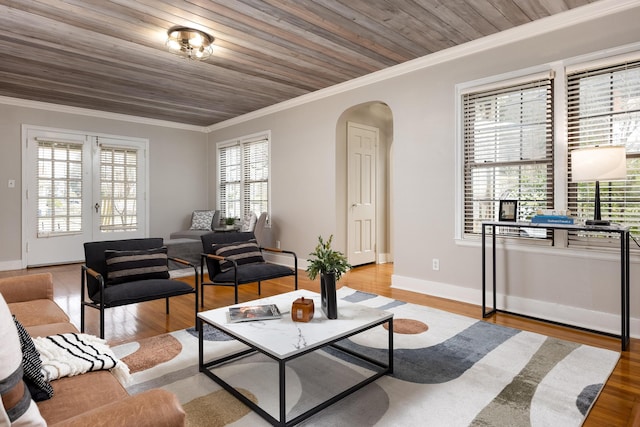 4220 Saint Elmo Ave, Chattanooga, TN 37409 - living room featuring arched walkways, ornamental molding, light wood-style flooring, wood ceiling, and baseboards