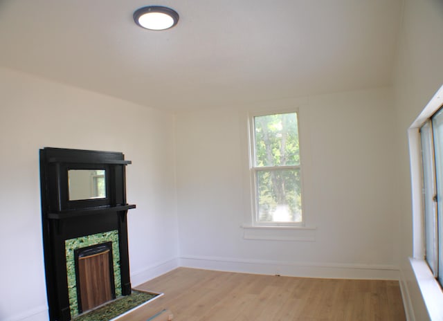 unfurnished living room with light hardwood / wood-style flooring