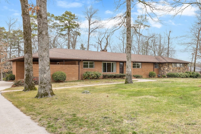 ranch-style home featuring a front yard