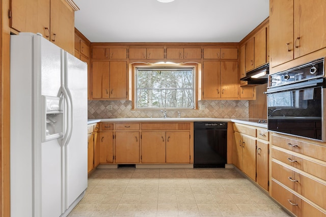 kitchen with tasteful backsplash, sink, and black appliances