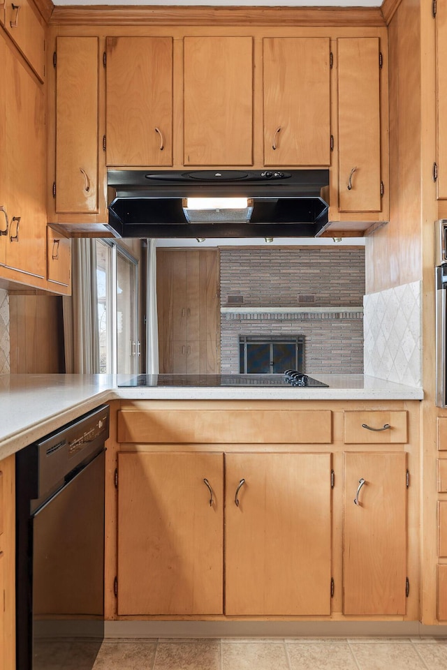 kitchen featuring extractor fan, decorative backsplash, and black appliances