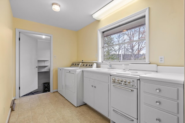 laundry room with washer and dryer and sink