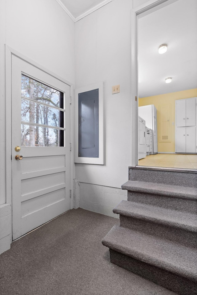 interior space with carpet floors, electric panel, and independent washer and dryer