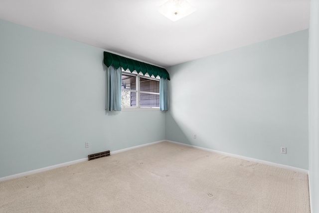 spare room featuring carpet flooring