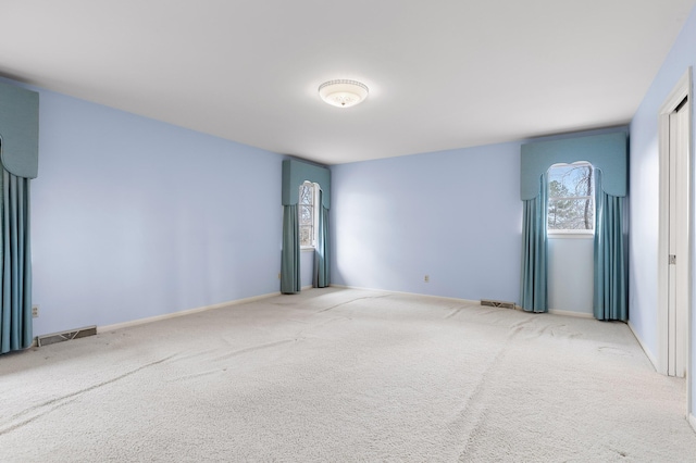 empty room featuring carpet flooring