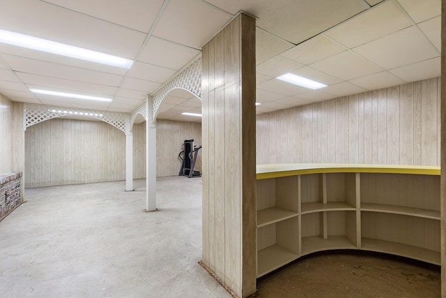 basement featuring a drop ceiling