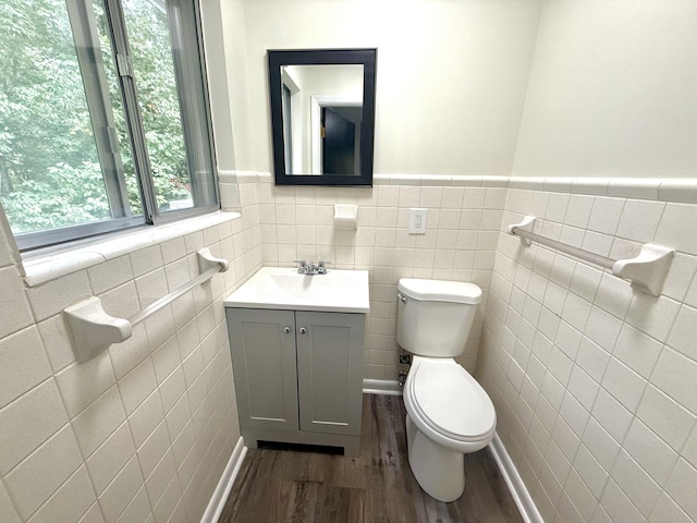 bathroom with vanity, hardwood / wood-style floors, and toilet