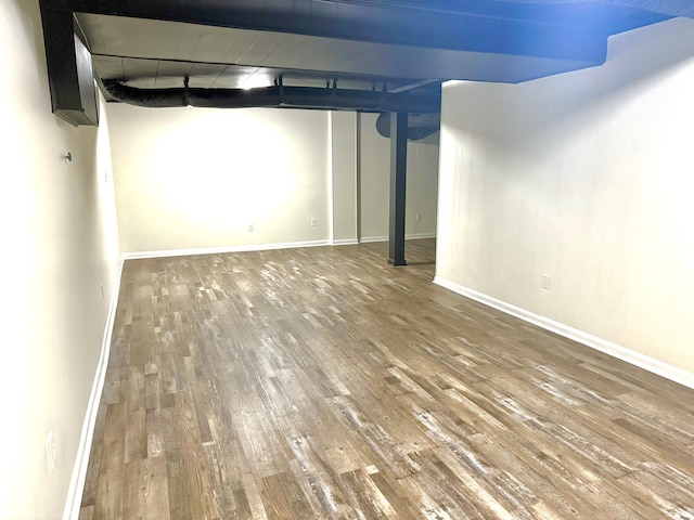 basement featuring wood-type flooring