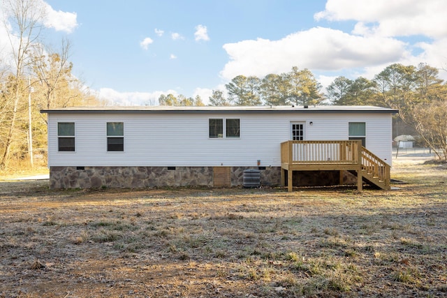 rear view of house with central air condition unit and a deck