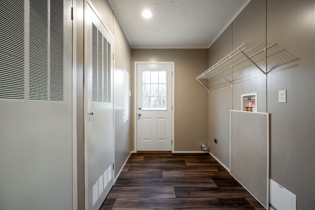 laundry room featuring washer hookup, dark hardwood / wood-style flooring, a textured ceiling, and electric dryer hookup