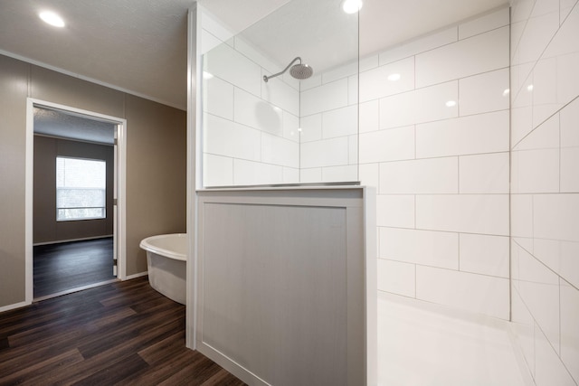 bathroom with hardwood / wood-style flooring and separate shower and tub