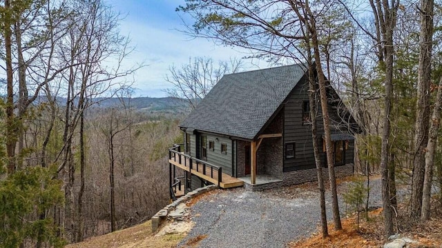 view of property exterior featuring a mountain view