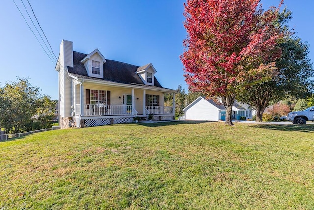 cape cod house with covered porch and a front lawn