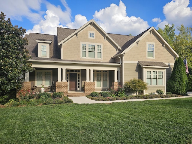 craftsman-style home featuring a front yard and a porch