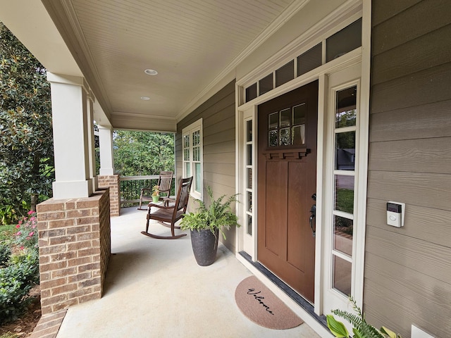 property entrance featuring covered porch