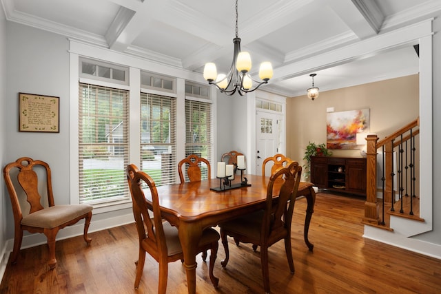 dining room with hardwood / wood-style flooring, ornamental molding, a chandelier, and beam ceiling