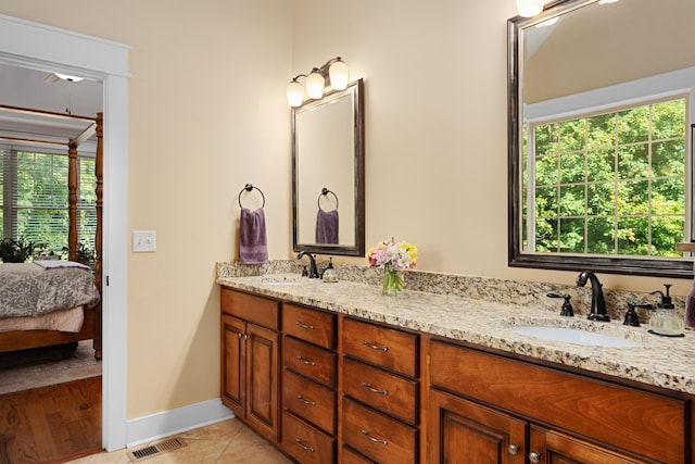 bathroom with vanity and tile patterned floors