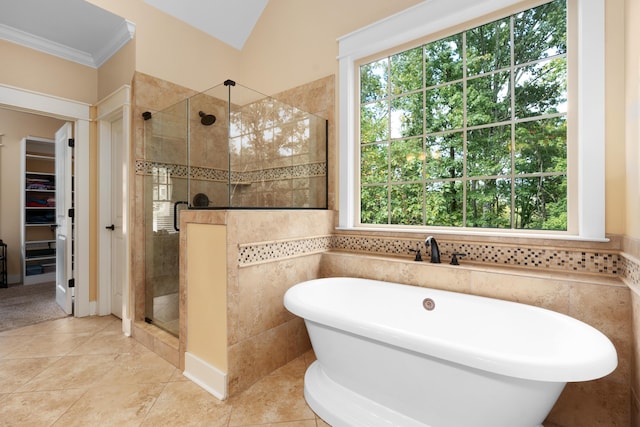 bathroom featuring tile patterned flooring, plus walk in shower, and crown molding