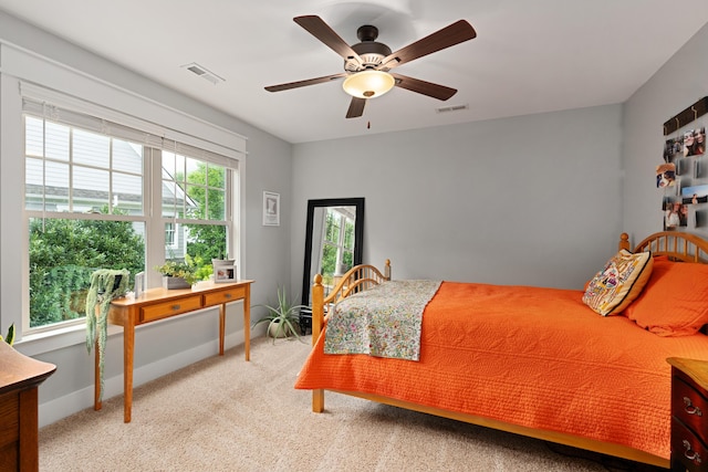 bedroom with ceiling fan and carpet floors