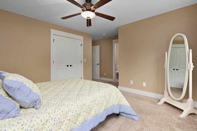 carpeted bedroom with a closet and ceiling fan