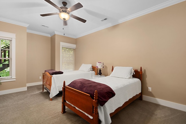 bedroom with ceiling fan, ornamental molding, and carpet