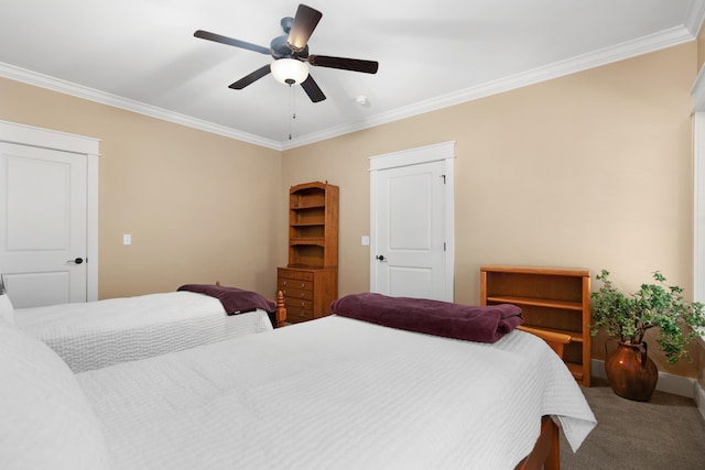 carpeted bedroom featuring ornamental molding and ceiling fan