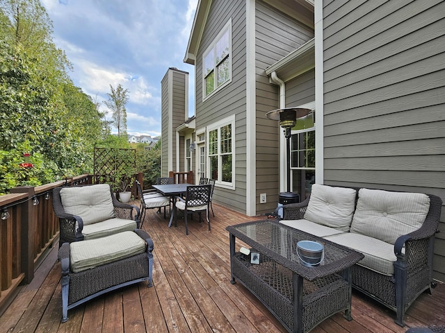 wooden deck featuring an outdoor hangout area