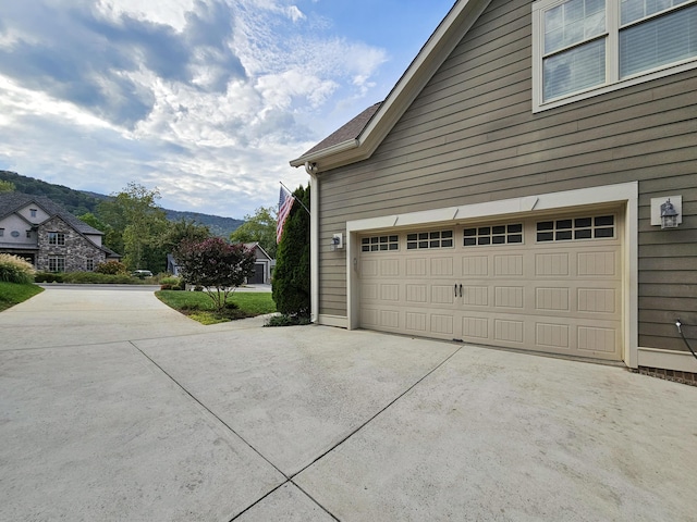 view of side of property with a mountain view