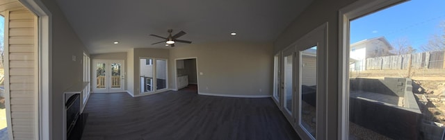 sunroom / solarium featuring lofted ceiling and ceiling fan