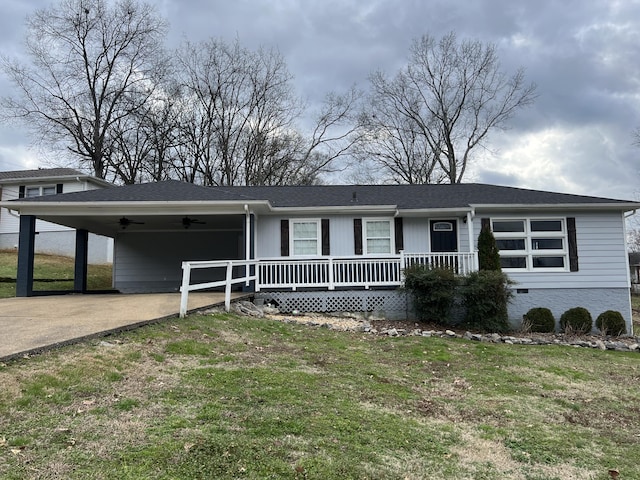 ranch-style home featuring a front yard and a carport