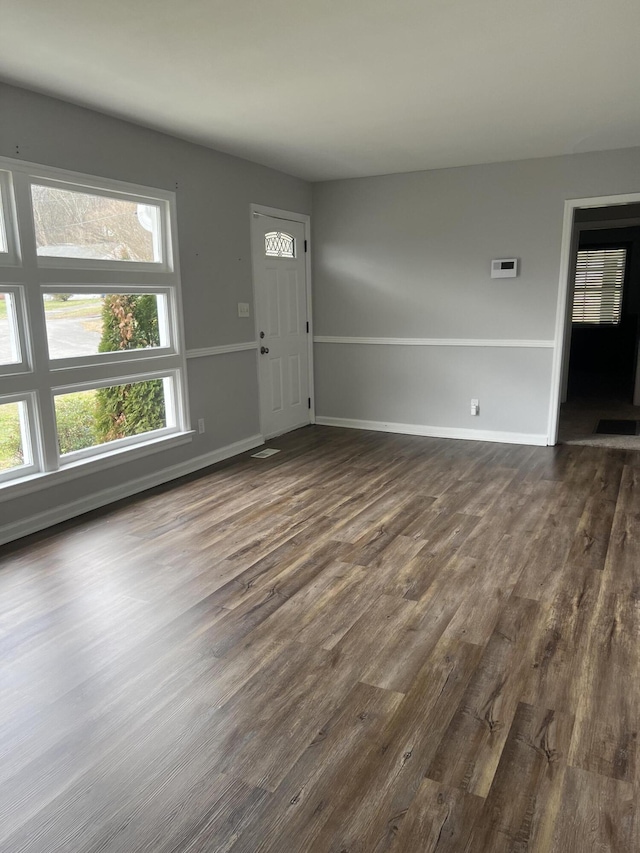 entryway with dark wood-type flooring