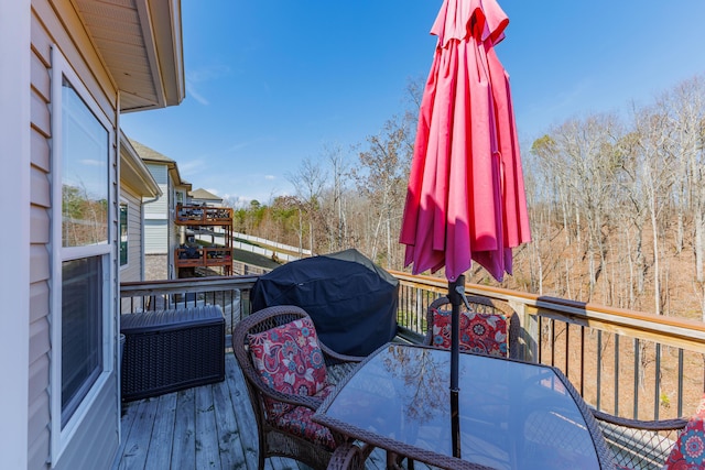 wooden terrace featuring area for grilling