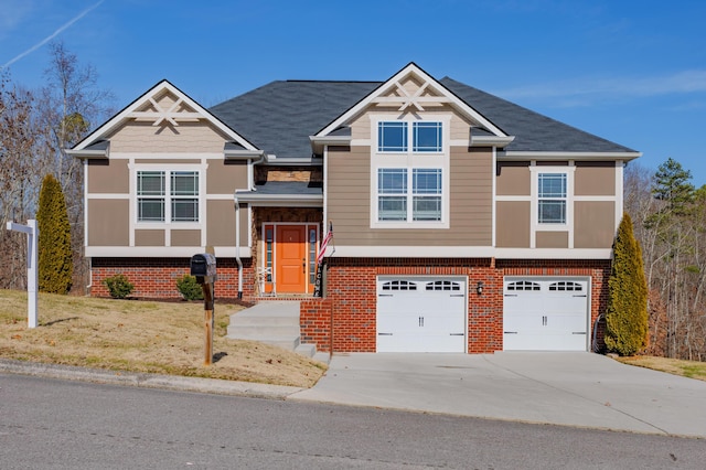 view of front of home with a garage and a front yard