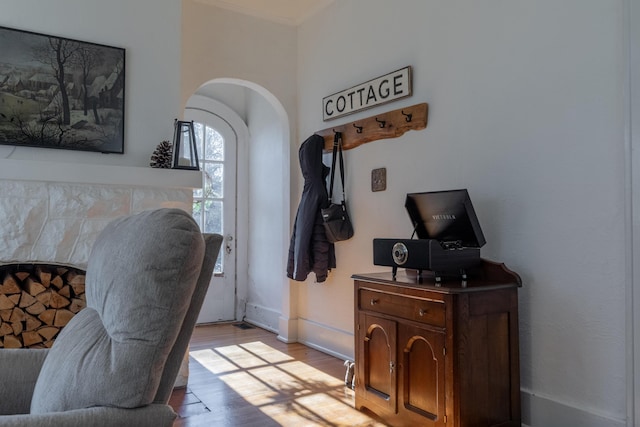 office space featuring ornamental molding and light wood-type flooring