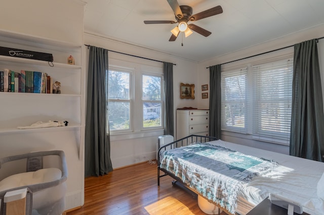 bedroom featuring ceiling fan and hardwood / wood-style floors