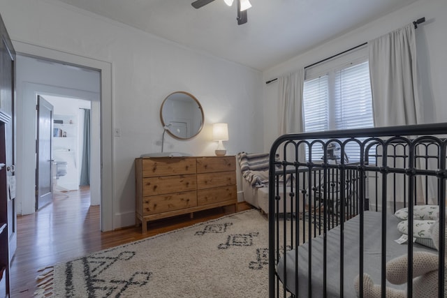 bedroom featuring dark hardwood / wood-style floors and ceiling fan