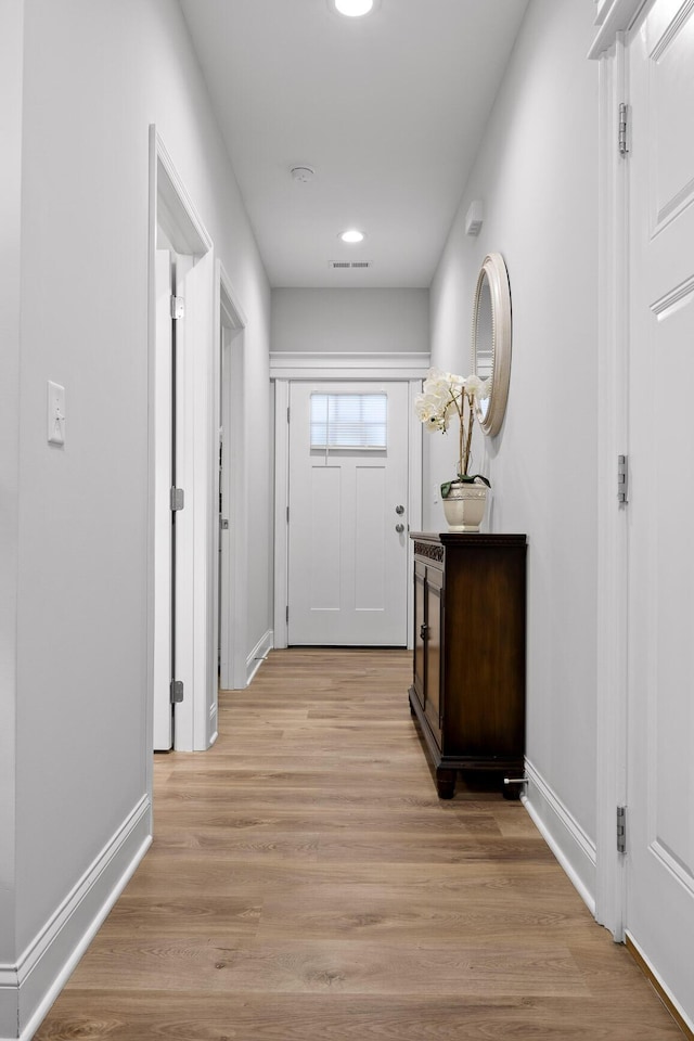 entryway with light hardwood / wood-style floors