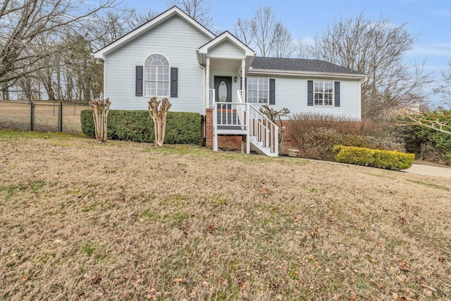 single story home featuring a front yard