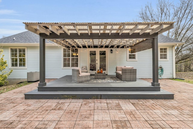 exterior space with a deck, a pergola, central AC, and an outdoor hangout area