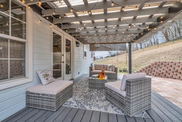 deck with a pergola and an outdoor hangout area