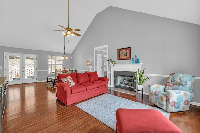 living room featuring ceiling fan, high vaulted ceiling, french doors, and hardwood / wood-style floors